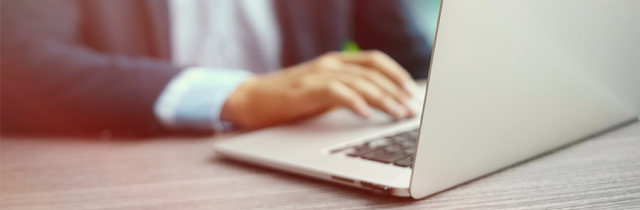 Man using laptop to research filing bankruptcy for a second time